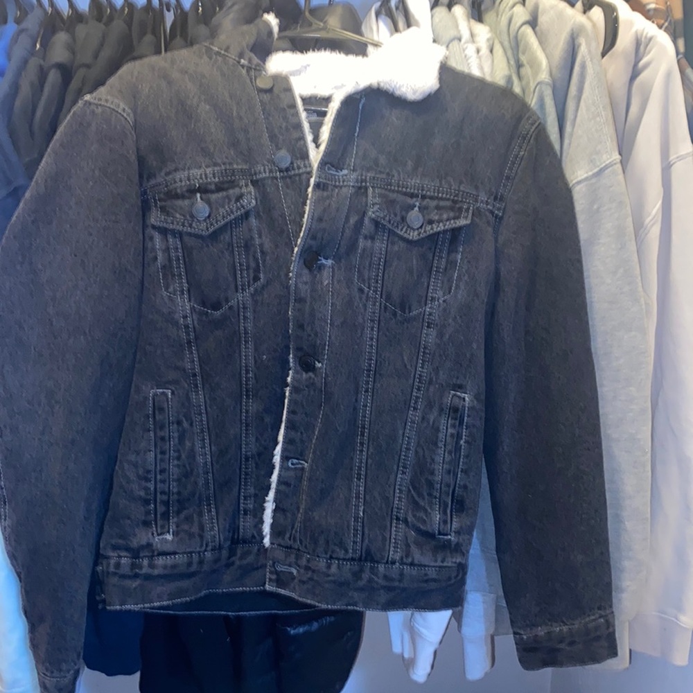Black denim jacket with white fur inside